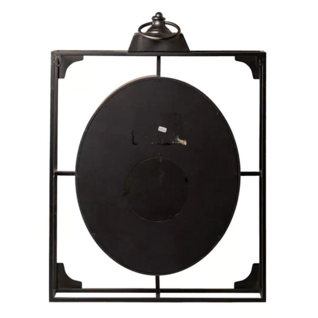 Black clock with decorative metal frame on a white background