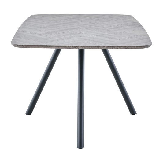 Square table with a light gray wooden top and dark legs on a white background