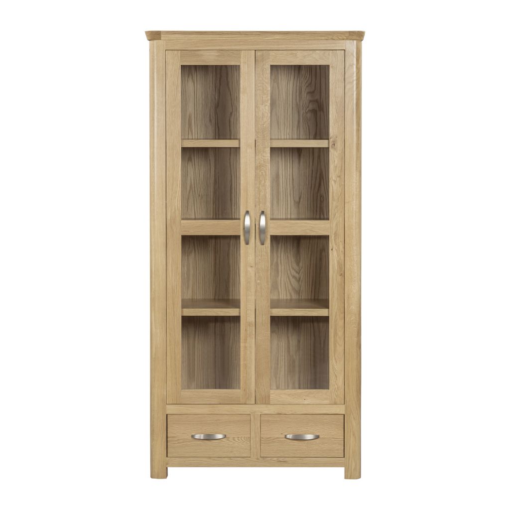 A tall light oak wood display cabinet with two glass-front doors, four shelves inside, two lower drawers, and silver metal handles.