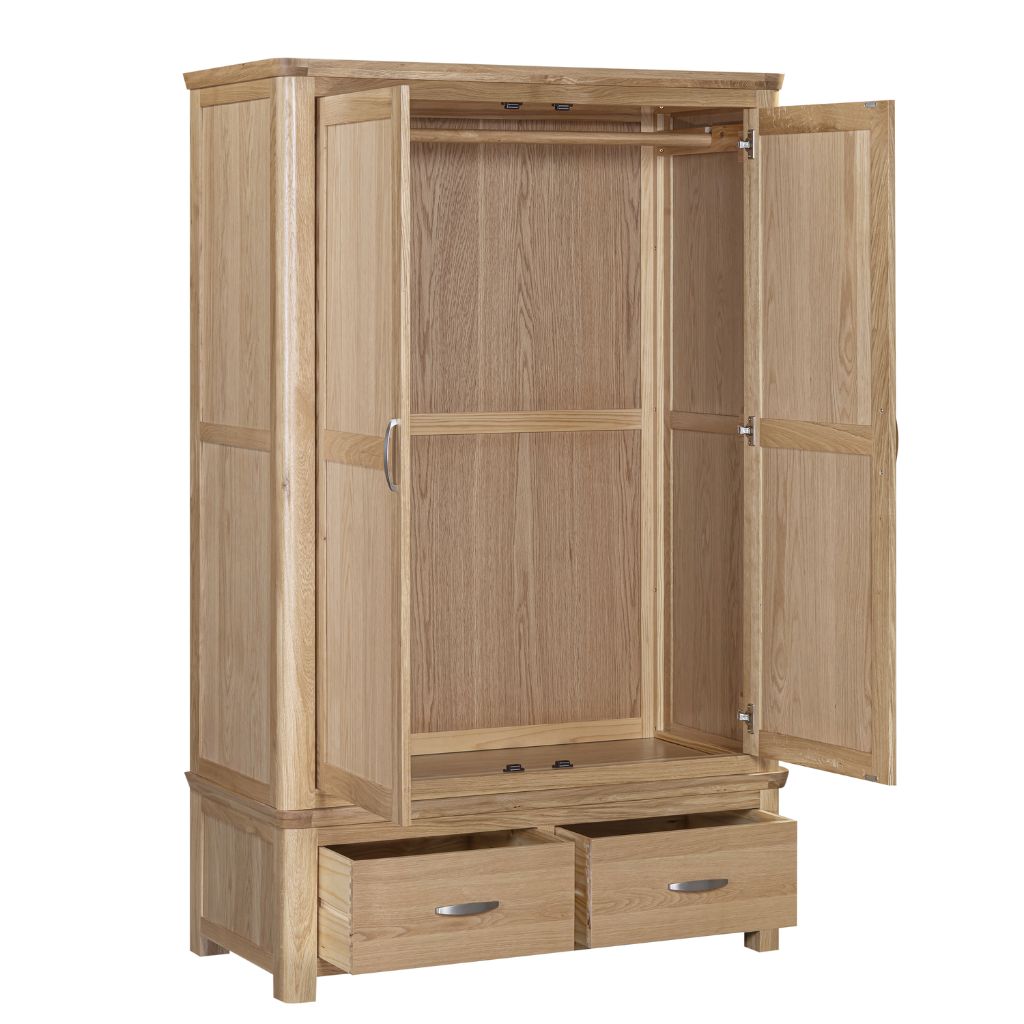 The interior of the wardrobe showing a top wooden rail and 2 bottom drawers all with silver handles.