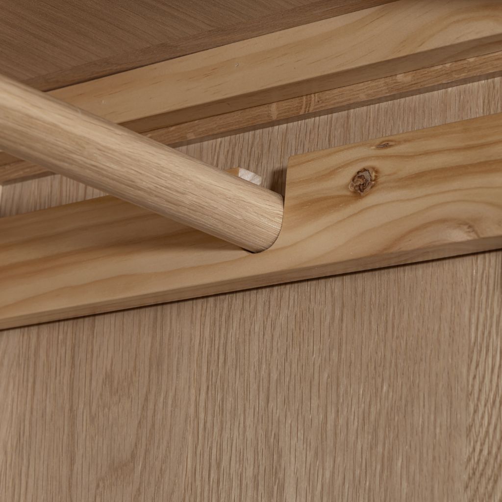 Close up of the wooden rail supported by an oak beam