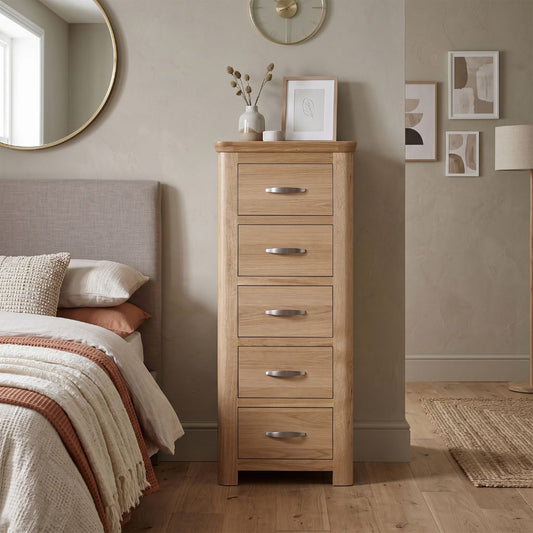 A tall 5 drawer chest perfect for storage in smaller spaces.
