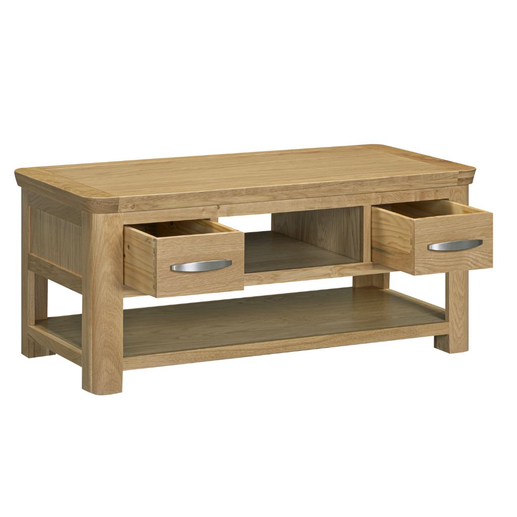 A stylish oak wood TV stand or coffee table with two drawers, one open, showing silver handles, and an open bottom shelf.