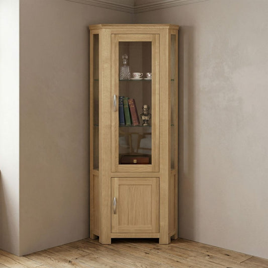 A tall corner wooden cabinet with a glass-front upper section and a lower solid wood door.