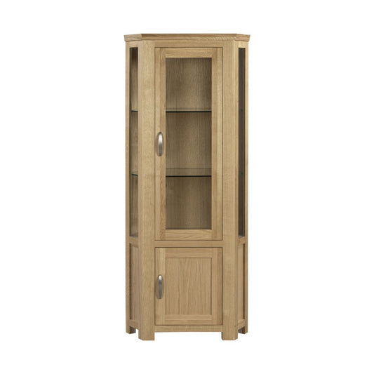 A corner wooden display cabinet with a light oak finish, featuring a glass-front upper door with two shelves.