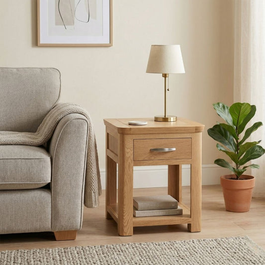 Oak end table with drawer and bottom shelf in a natural oak finish.