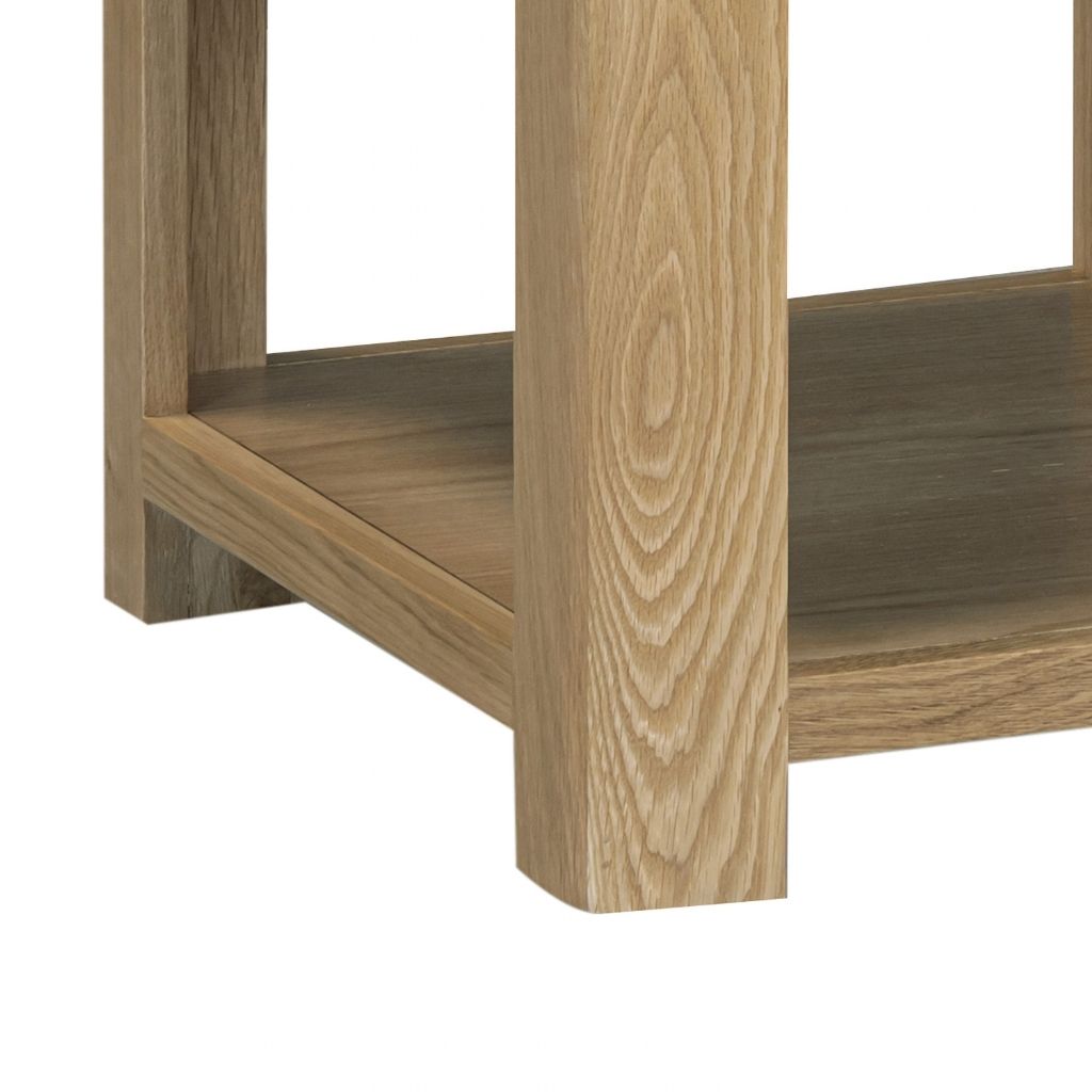 Close-up of a wooden shelf and leg detail, showing natural oak wood finish
