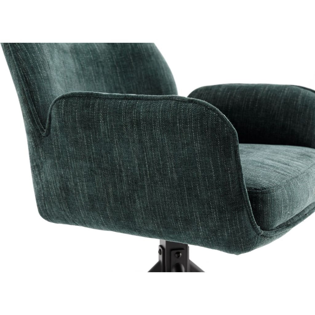 Green upholstered chair on a white background