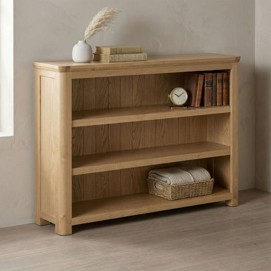 A low oak bookcase with 3 shelves