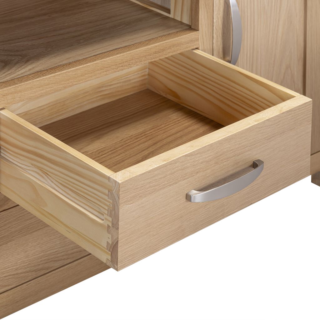 Close up of the craftmanship behind the drawers with gorgeous metal handles and stunning dovetailed joints.