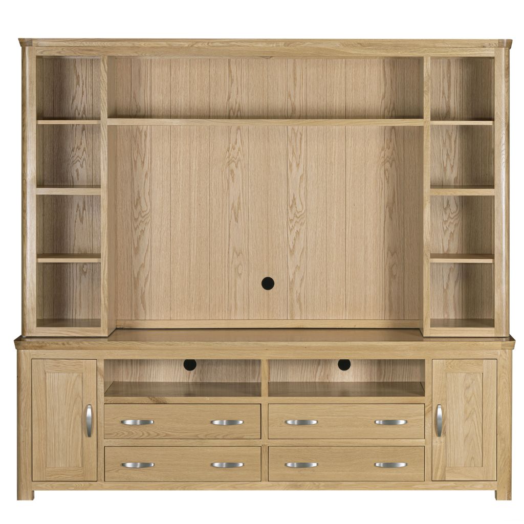 A light oak wood media unit with open shelving on the top, side cabinets, and four drawers with silver handles on the bottom.