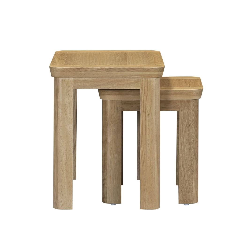 Solid oak nesting tables featuring gorgeous curved legs.