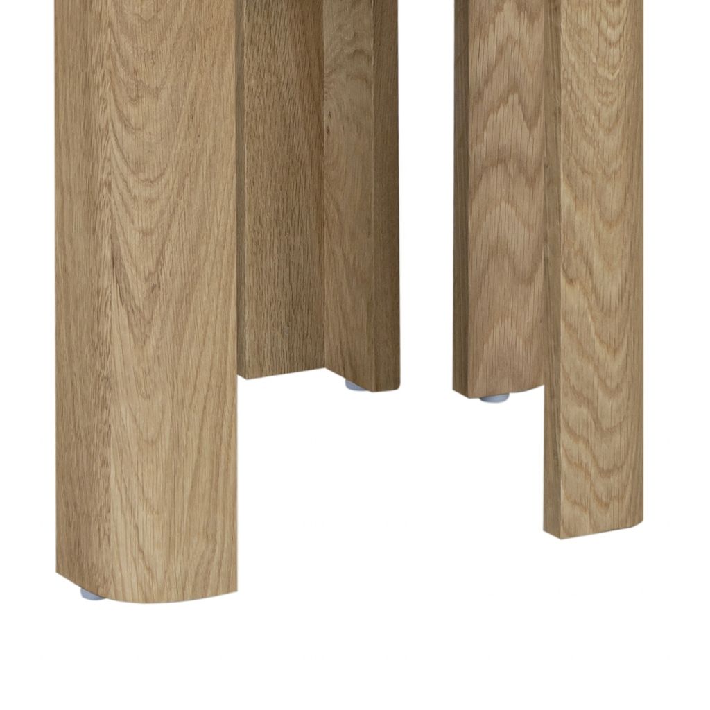 Close up of the stunning curved table legs in a natural oak finish 