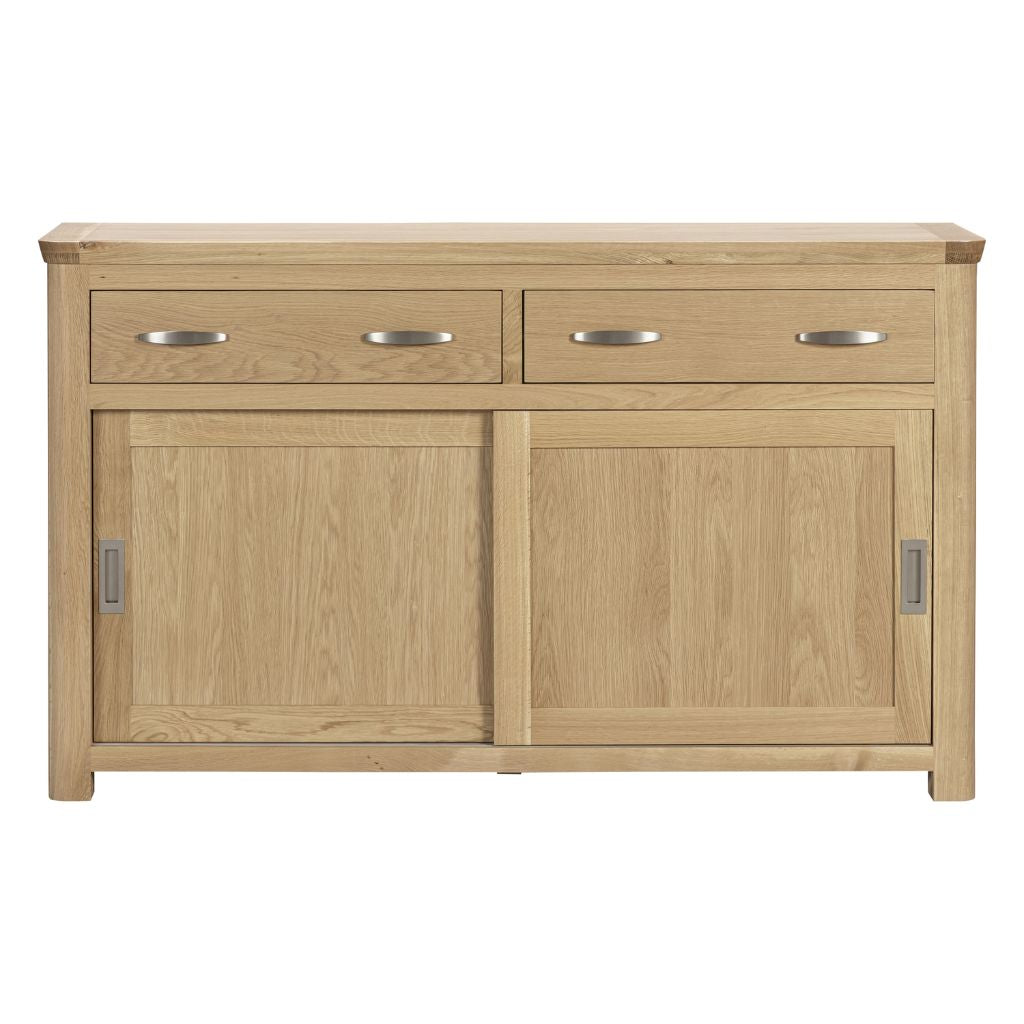 A gorgeous oak sideboard with modern sliding doors and beautiful drawers featuring metal handles to complete its look.