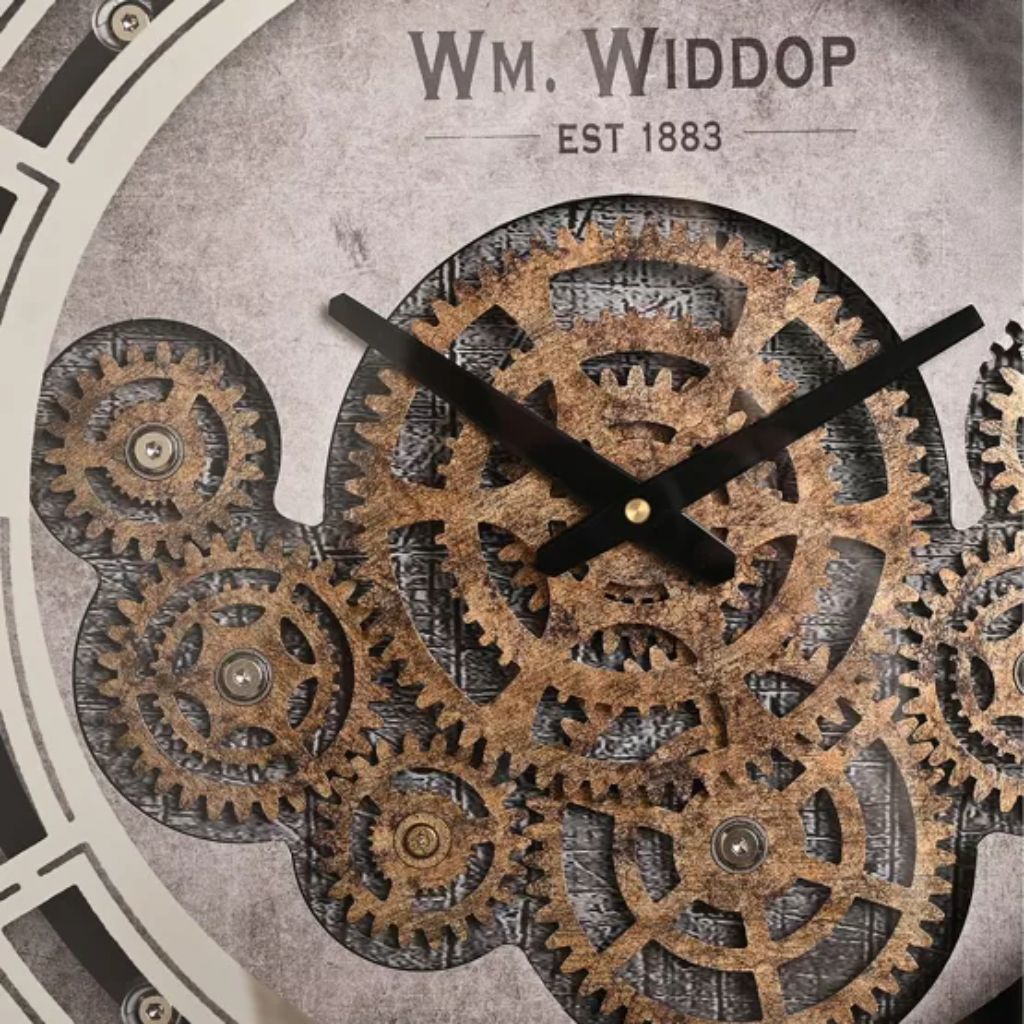 Close-up of a clock face with intricate gear design and 'Wm. Widdop' branding.