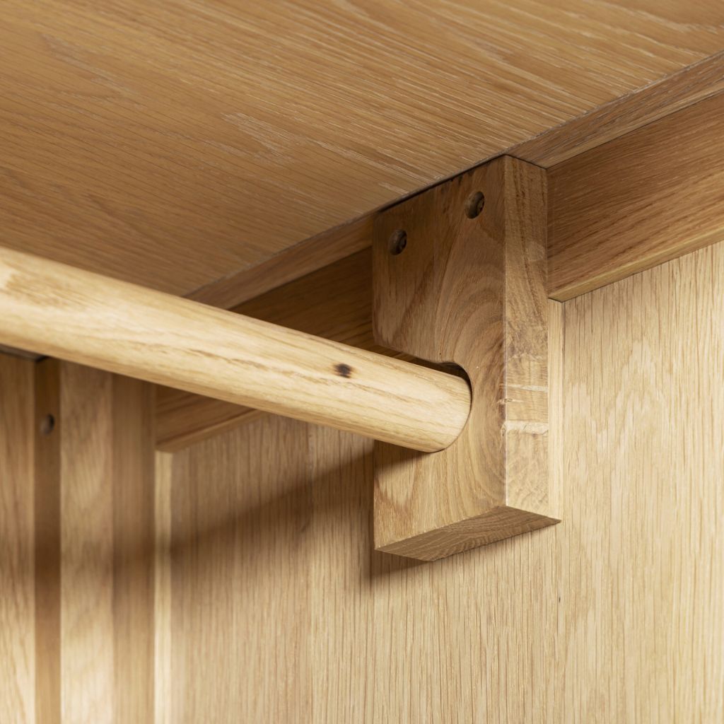 Close-up of wooden shelf bracket on a wooden surface
