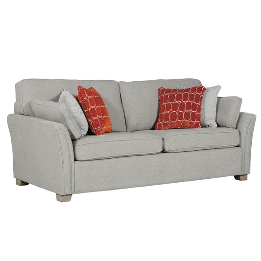 Natural sofa with red and natural patterned cushions on a white background