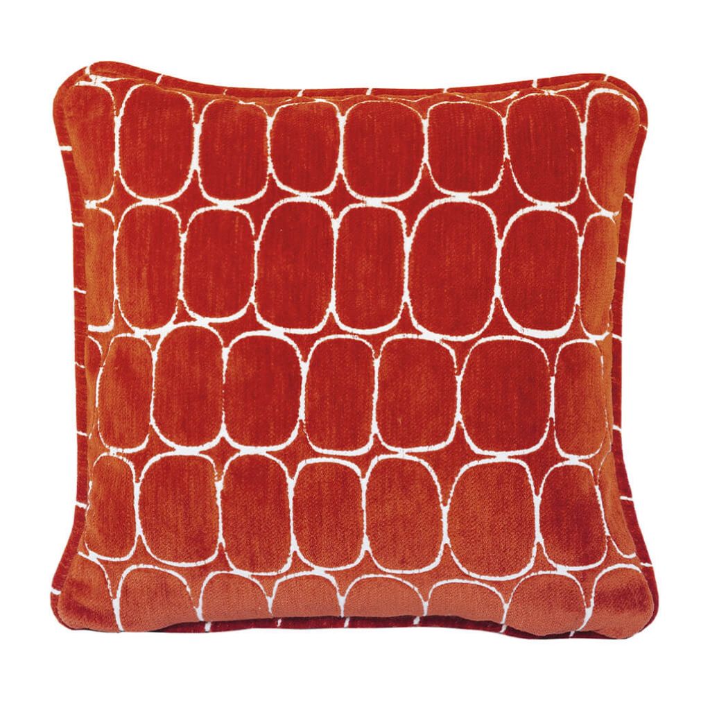 Red cushion with white geometric pattern on a white background