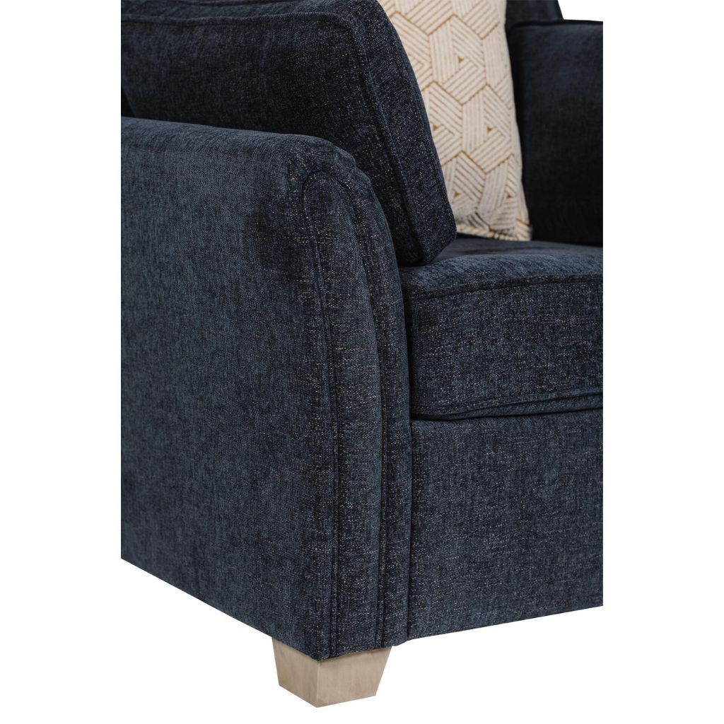 Blue upholstered chair with a textured fabric finish on a white background