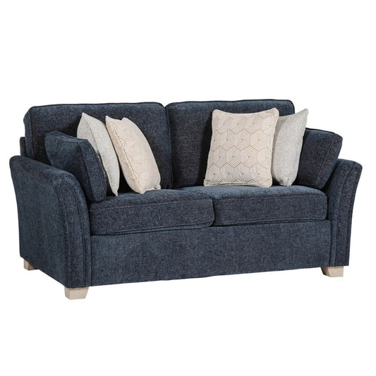 Blue sofa with decorative pillows on a white background