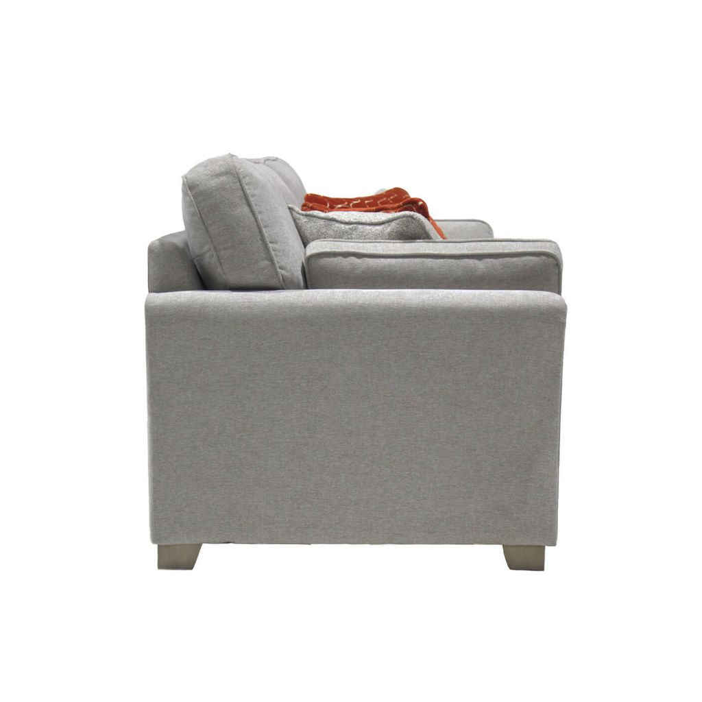 Side view of the gorgeous winnie sofa bed with grey wooden feet to complete its look.