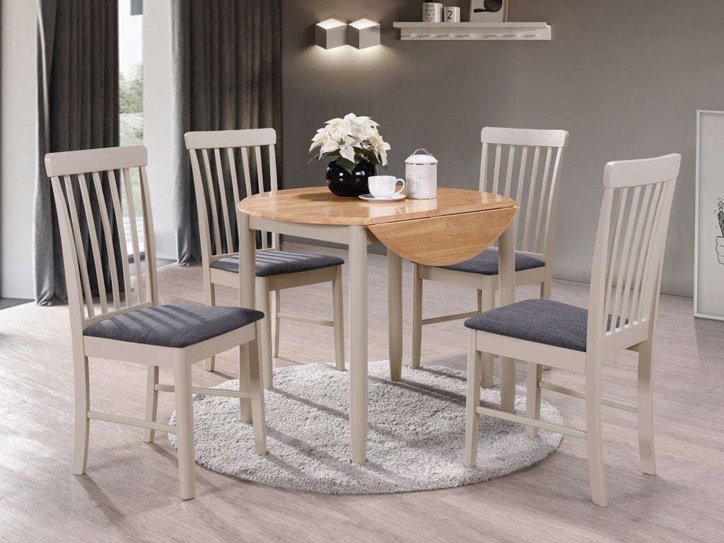 Round wooden dining table with four cream high-back chairs and grey padded seats.