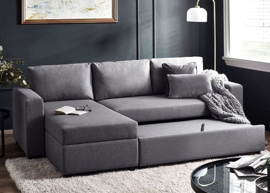 Grey sofa with chaise lounge and pull-out bed.