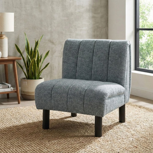 Grey upholstered chair with solid black legs and vertical stitching.