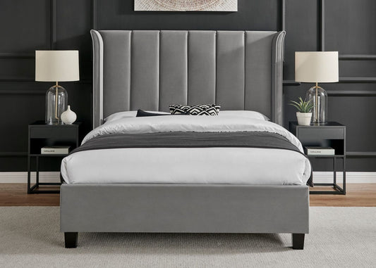 Modern grey upholstered bed with wingback headboard