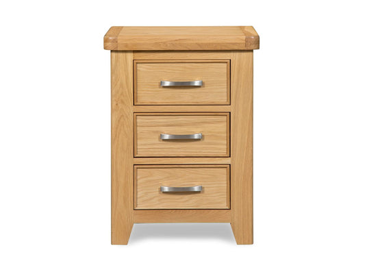 Solid oak wood three-drawer bedside chest with silver handles.