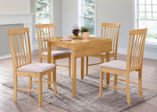 Wooden dining table set with four chairs in a light finish and cushioned seats